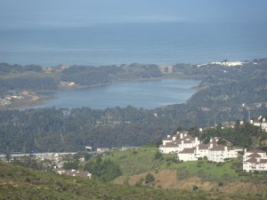 View of Lake Merced from the Summit Loop trail, with a hillside settlement on the right.