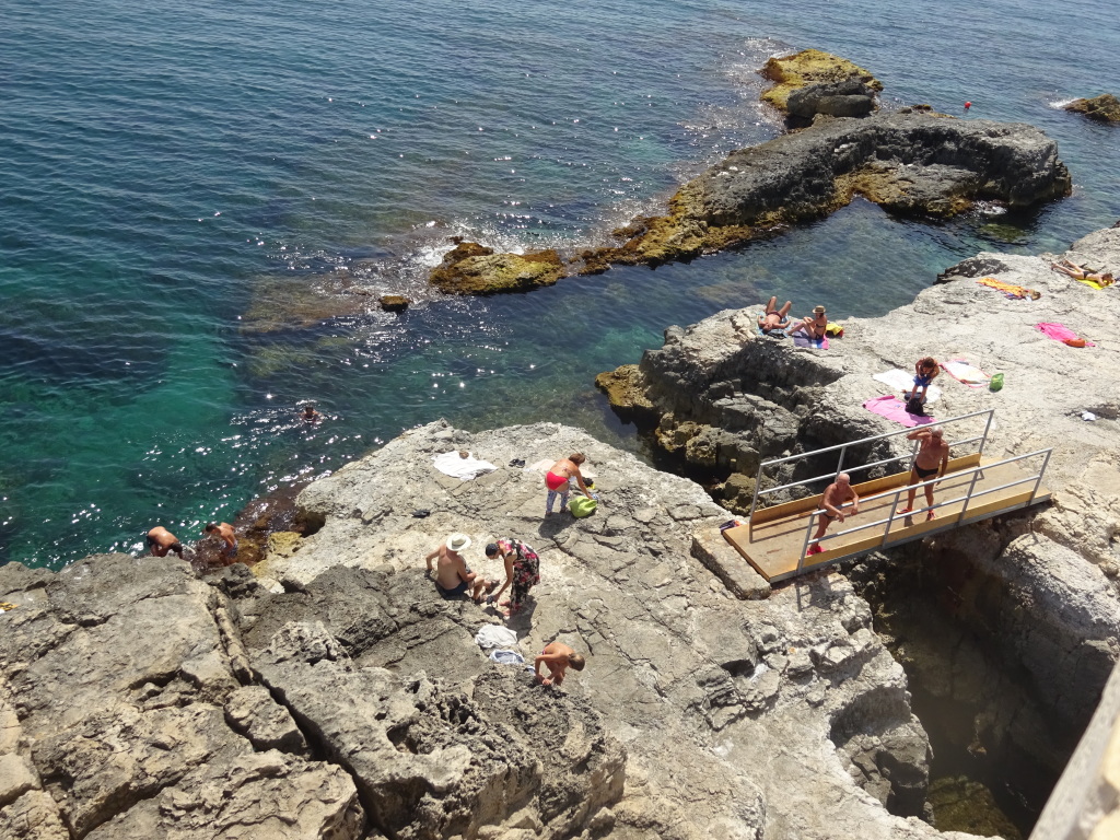 Overview of the rockiest parts of the Solarium beach in Ortigia, in Siracusa.